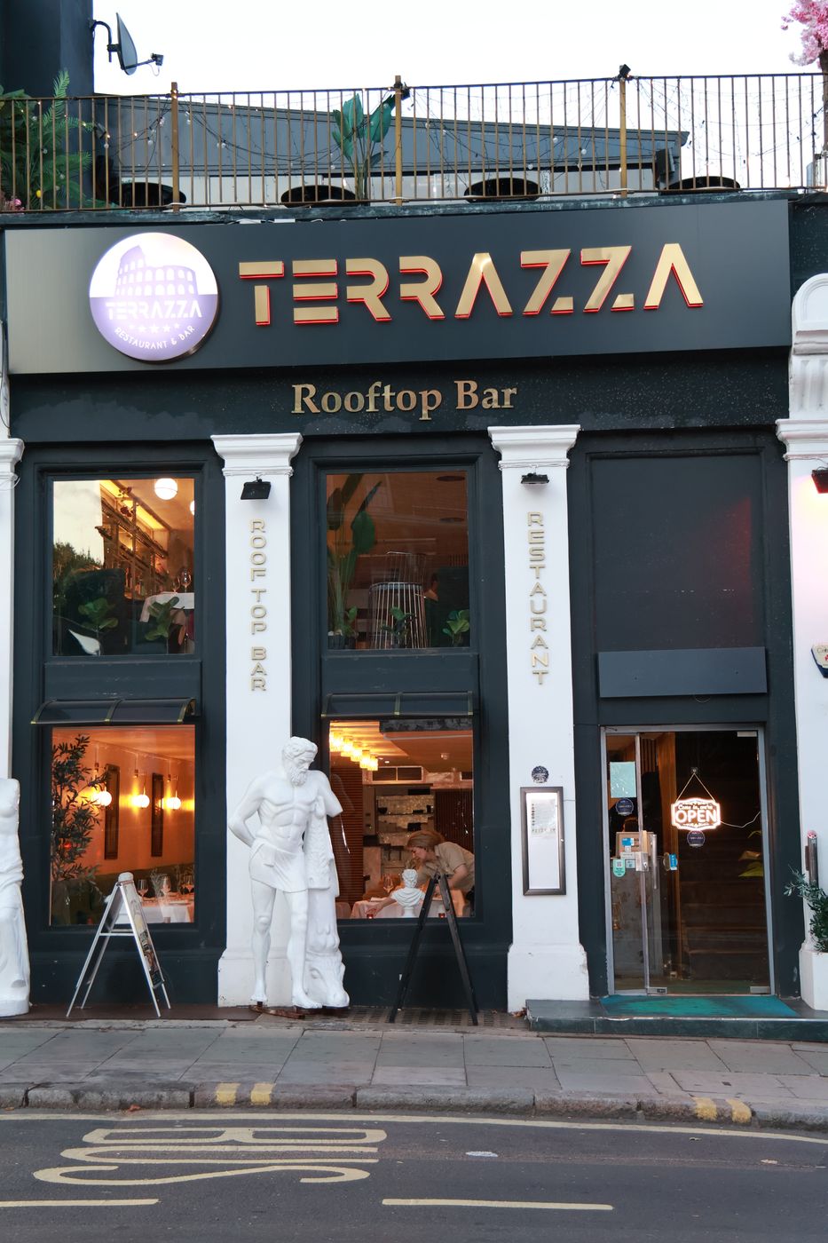 Terrazza's front on Haverstock Hill with its two white statues and gold sign