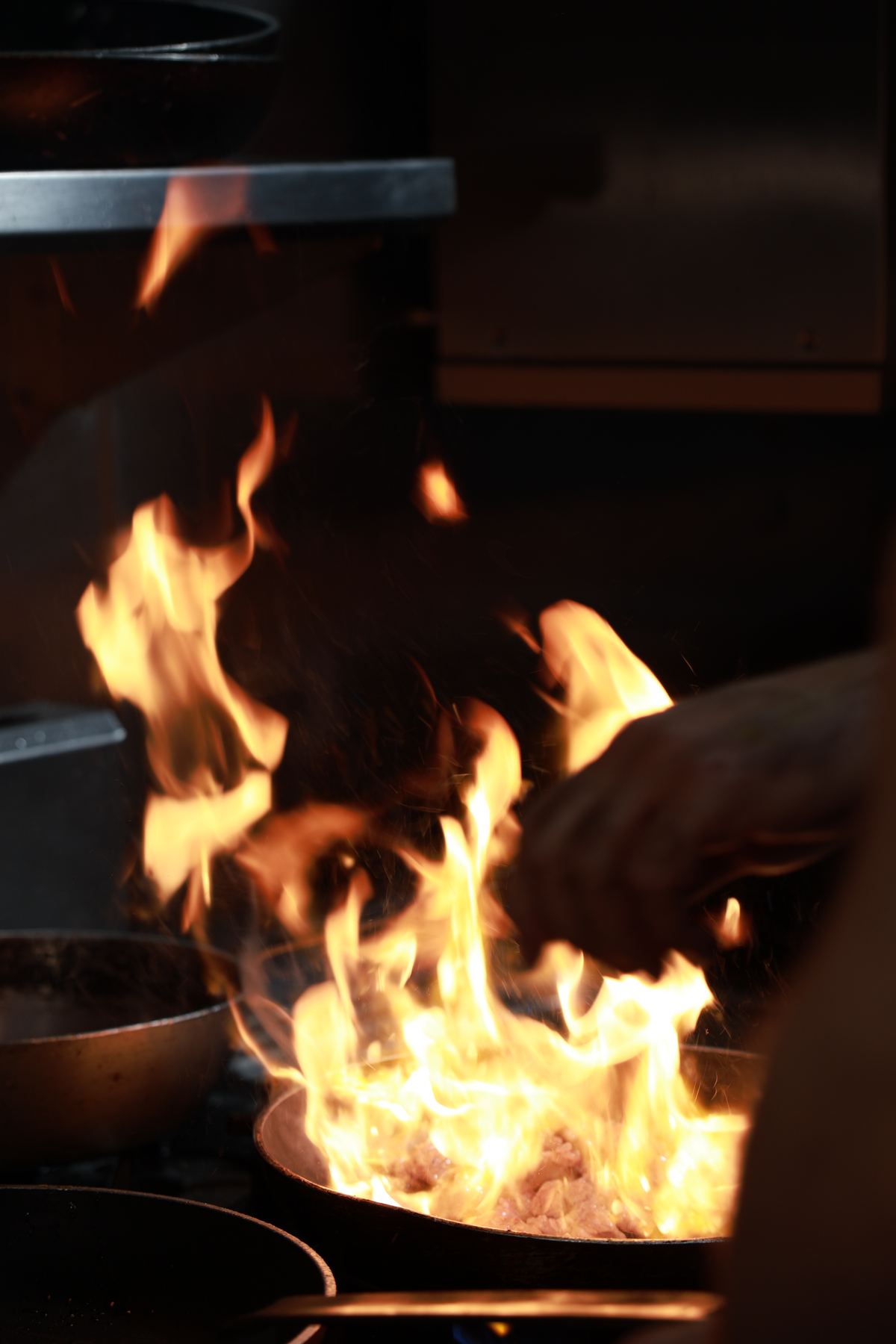 Flames rising from a pan in the kitchen