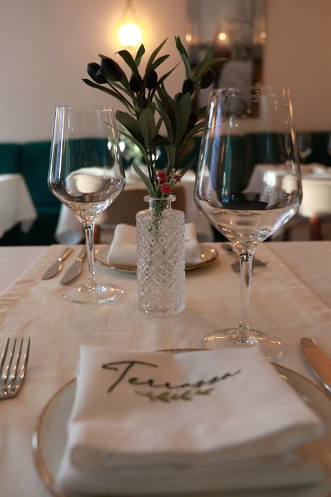 A table laid with our embroidered napkins