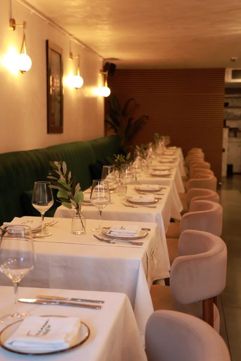 Wall lights and velvet banquettes