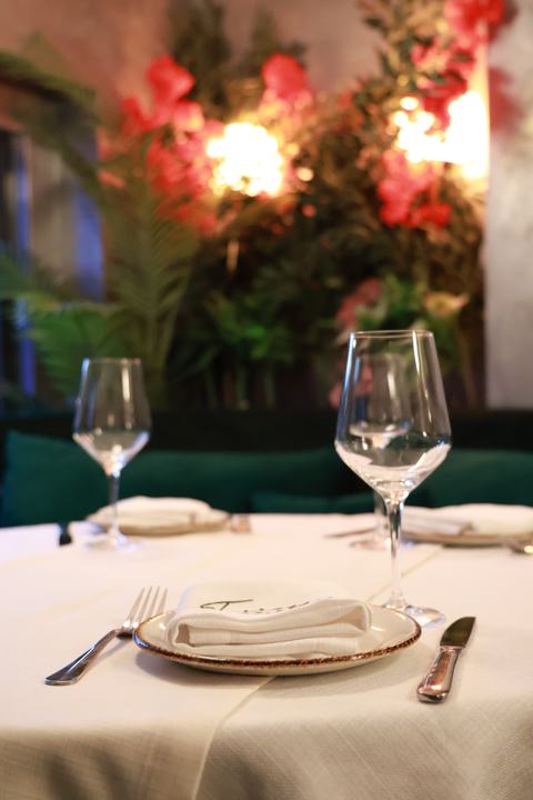 The flower wall and velvet booths